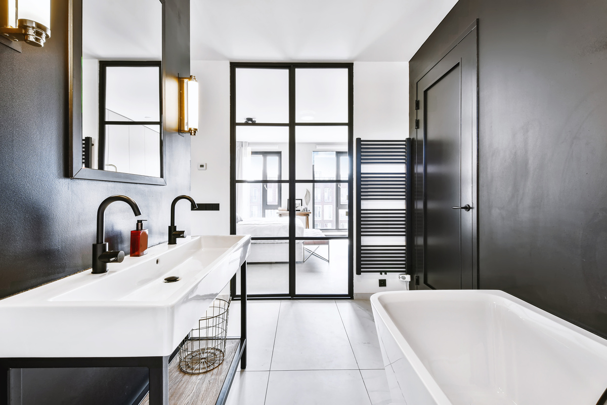 a modern bathroom with black walls and white floors